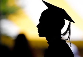 File picture shows the silhouette of a student with a graduation cap during a diploma ceremony at the John F. Kennedy School of Government